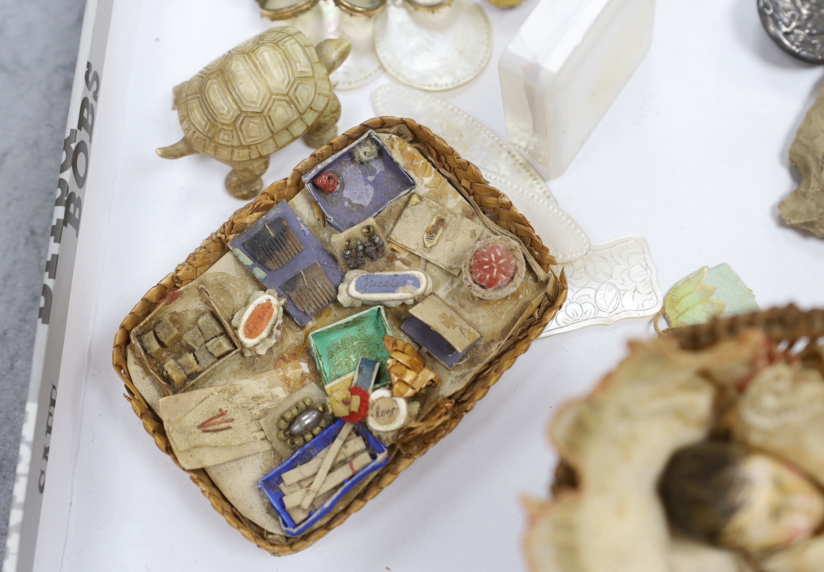 A collection of cabinet curiosities, including carved lava portrait medallions, porcelain scent bottles, etc. (a large quantity)